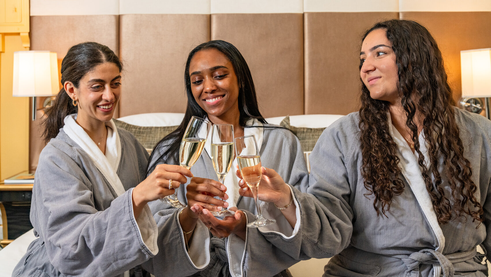 Bridal party sparkling wine cheers at kimpton hotel monaco dc