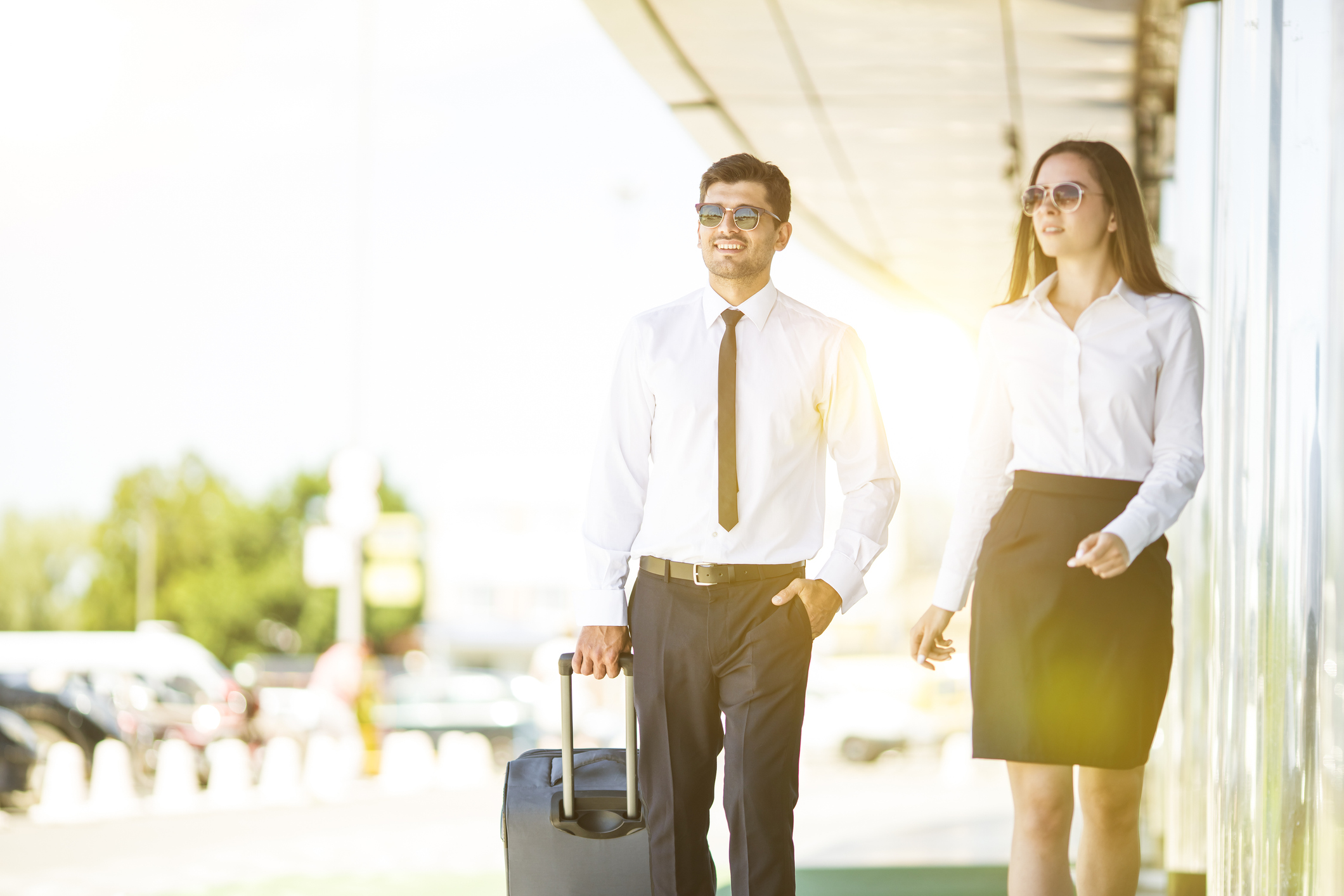 Two people in businesswear walking