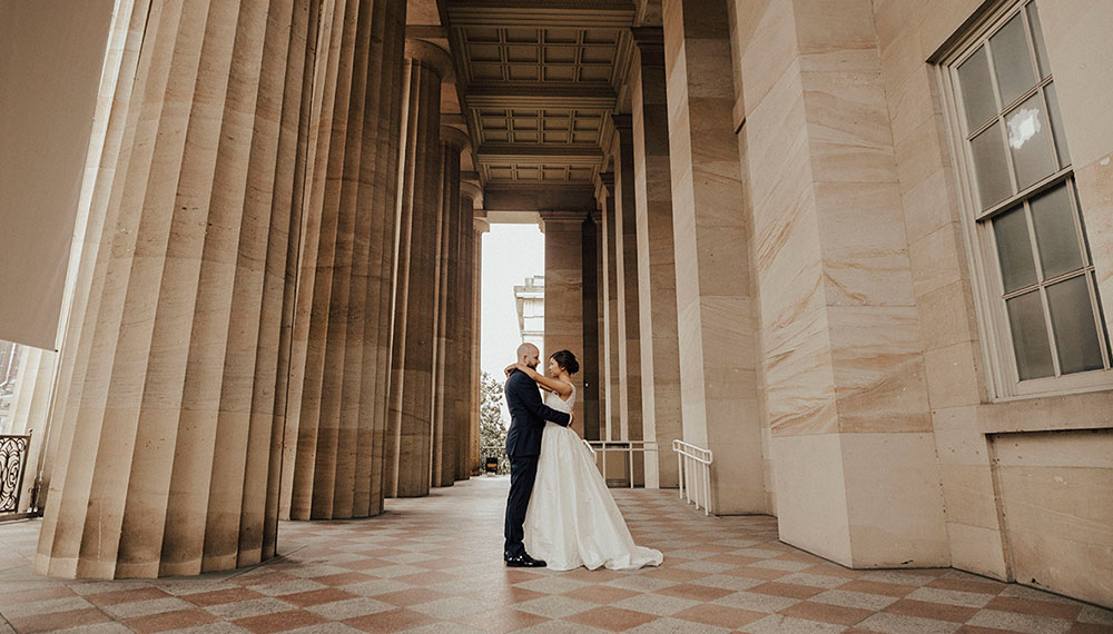 Newlyweds outside hotel