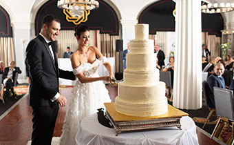 Bride and groom with wedding cake